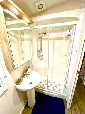 a bathroom with a shower and a sink at The Beach Retreat in Par