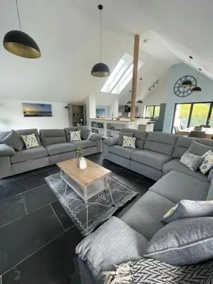 a living room with a couch and a coffee table at Gulland 4 Bed Sleeps 8 with Hot tub in Treknow