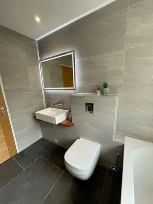a bathroom with a white toilet and a sink at Gulland 4 Bed Sleeps 8 with Hot tub in Treknow