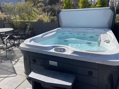 a jacuzzi tub sitting on top of a patio at The Retreat in Bodmin