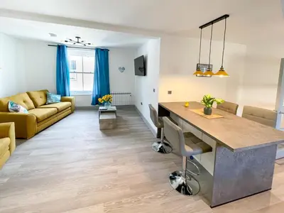 a kitchen and living room with a couch and a table at 2 Bed in St. Ives oc-s28155 in St Ives