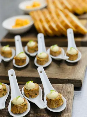 a group of spoons with mini desserts on them at Halfway House Inn in Wadebridge