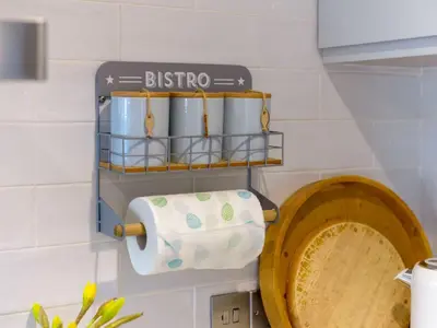 a bathroom with a toilet paper holder and a sink at Apartment Tintagel Sea view by Interhome in Treknow