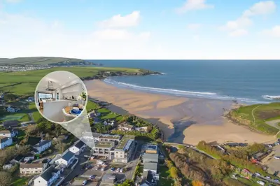 an aerial view of a beach with a house at 2 Bed in Harlyn Bay oc-s28921 in St Merryn