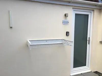 a building with a door and a window at Sunnyside Retreat in St Ives