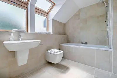 a bathroom with a sink and a toilet and a bath tub at 3 Bed in Trevone oc-c29020 in Padstow