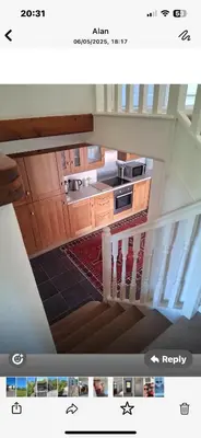 an overhead view of a kitchen with a staircase at Trelowen Cottage in Callington