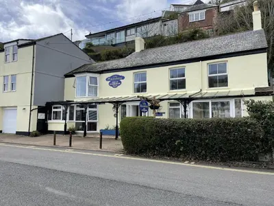 a white building on the side of a street at Little Mainstone Guest House in Looe