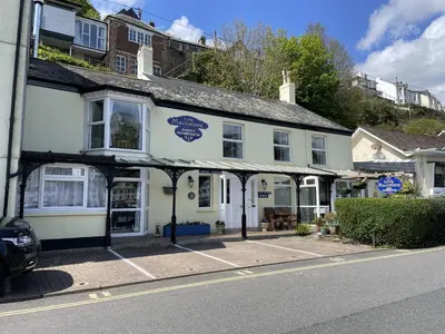a white building on the side of a street at Little Mainstone Guest House in Looe