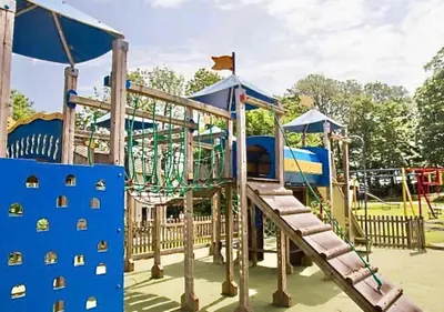 a playground with a slide in a park at 4 Bedroom House at Atlantic Reach-Newquay-Cornwall in Newquay