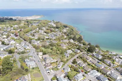 an aerial view of a town next to the water at Chy An Gweal Farm Cottage in Carbis Bay