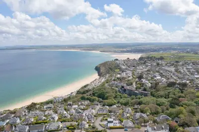 an aerial view of a town and the beach at Chy An Gweal Farm Coach House in Carbis Bay