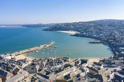 an aerial view of a beach with boats in the water at Chy An Gweal Farm Coach House in Carbis Bay