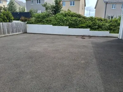 a parking lot in front of some houses at double room in Wadebridge