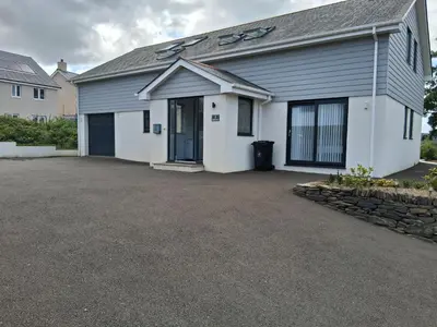 a house with a driveway in front of it at double room in Wadebridge