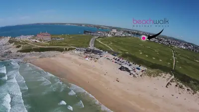 an aerial view of a beach and the ocean at Beachwalk in Newquay