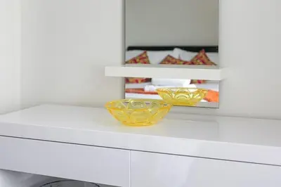 a white counter with two bowls on top of it at Beachwalk in Newquay