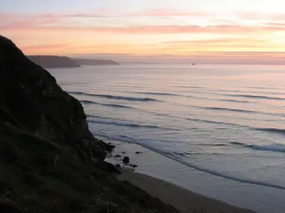 a view of a beach with the ocean at Malvern Cottage in Perranporth