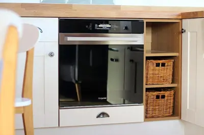 a microwave oven sitting inside of a kitchen at Scandi Cabin On A Hill, With Stunning Views Across Cornwall in Nancledra