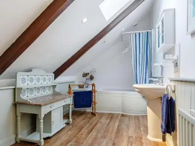a bathroom with a sink and a vanity with a sink at 3 Bed in Newquay oc-82369 in Mitchell