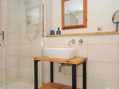 a bathroom with a sink and a shower at The Bower in Helston