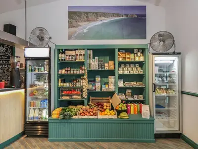a produce section of a store with fruits and vegetables at Breeze Cottage in Falmouth