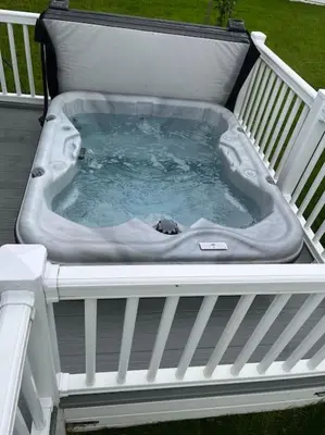 a hot tub on top of a deck at The Cornish hottub escape in St Austell