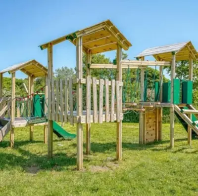a group of playground equipment in a field at The Cornish hottub escape in St Austell
