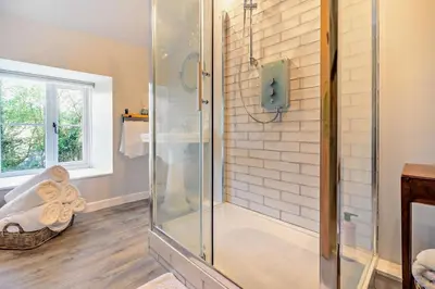 a shower with a glass door in a bathroom at 3 Bed in Germoe oc-w29163 in Germoe