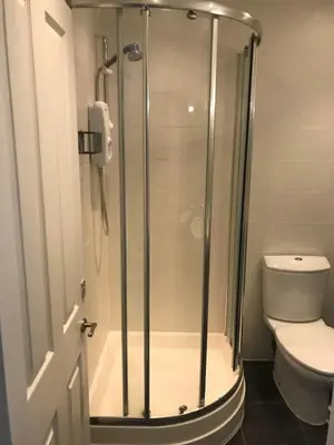 a bathroom with a glass shower with a toilet at No 63 Atlantic reach in Newquay