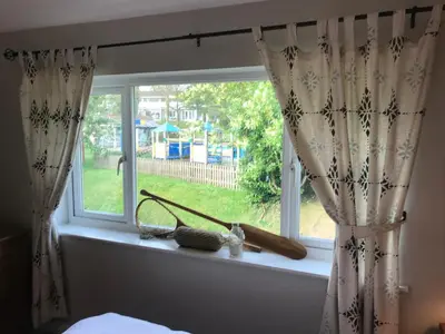 a window with a view of a yard at No 63 Atlantic reach in Newquay