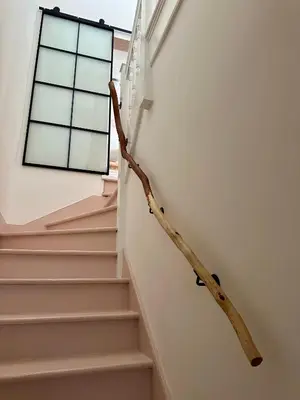 a branch on the side of a staircase with a window at no.five Flushing in Flushing