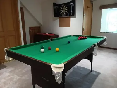 a pool table with balls on it in a room at Cottage hideaway on the edge of Bodmin Moor in Launceston