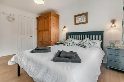 a bedroom with a bed with two towels on it at 3 Bed in Padstow oc-p29061 in Padstow