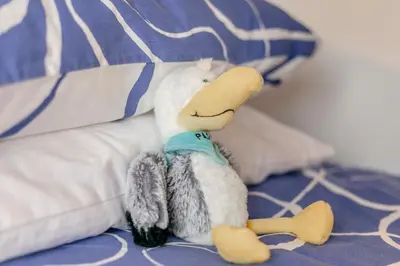 a stuffed animal sitting on top of a bed at 3 Bed in Padstow oc-p29061 in Padstow