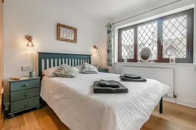 a bedroom with a bed with two towels on it at 3 Bed in Padstow oc-p29061 in Padstow
