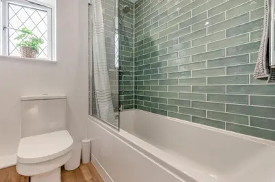 a bathroom with a toilet and a bath tub at 3 Bed in Padstow oc-p29061 in Padstow