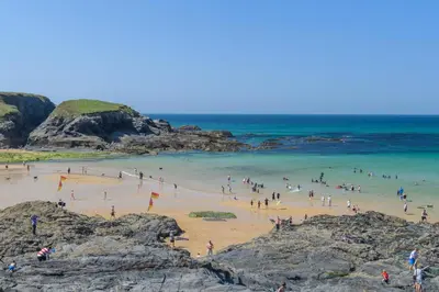 a group of people on a beach near the ocean at 3 Bed in St. Merryn oc-l29062 in St Merryn