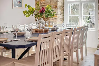a dining room with a black table and chairs at 7 Bed in St. Agnes oc-p28968 in St. Agnes