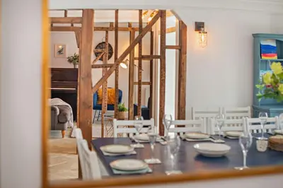 a dining room with a table and a mirror at 7 Bed in St. Agnes oc-p28968 in St. Agnes