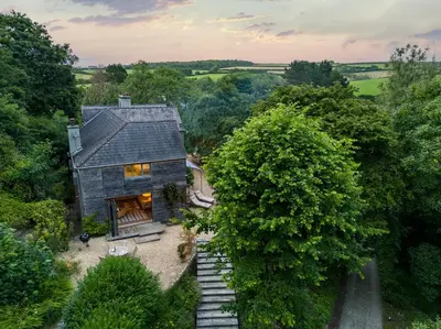 an overhead view of a small house in the woods at 5 Bed in Little Petherick oc-s29057 in Little Petherick