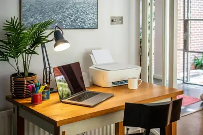 a desk with a computer and a printer on it at 5 Bed in Little Petherick oc-s29057 in Little Petherick