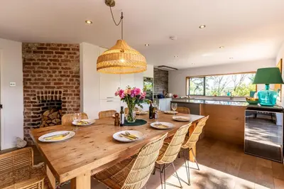 a dining room with a large wooden table and chairs at 5 Bed in Little Petherick oc-s29057 in Little Petherick
