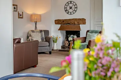 a living room with two chairs and a fireplace at 3 Bed in Treknow oc-h29194 in Treknow
