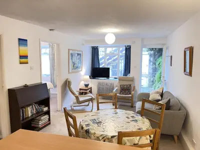 a living room with a couch and a table at 3 Redfern Court in St Ives