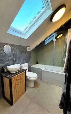 a bathroom with a sink and a toilet and a tub at Palms 2 Private Garden Parking Central Newquay in Newquay