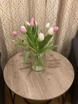 a vase of pink and white flowers on a table at Stepping Stones Cottage - Lelant, Nr St Ives in St Ives