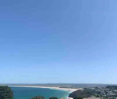 a view of a beach and the ocean at Carbis Daze Ocean Views Studio, SuperKing bed St Ives Carbis Bay in Carbis Bay