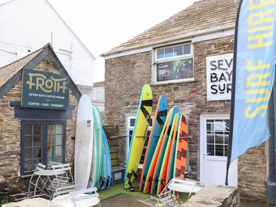 a group of surfboards are lined up outside of a building at Flat 1 Niles Place in Padstow