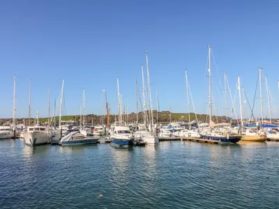 a bunch of boats docked in a harbor at Carrick Cottage in Falmouth